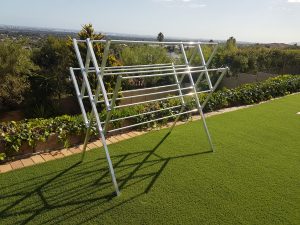 Altimo aluminium clothing drying rack on grass with a view